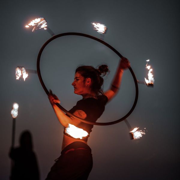 Silhouette of a man in a dynamic pose showing focus and control.
